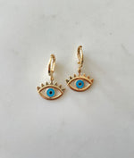 Load image into Gallery viewer, Huggie Earrings with Evil Eye Charm
