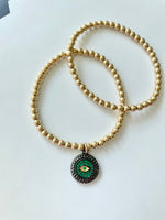 Load image into Gallery viewer, 14k Gold Filled Beaded Bracelet with Green and Black Evil Eye Charm
