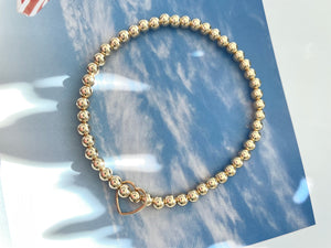 Gold Beaded Bracelet with Floating Heart