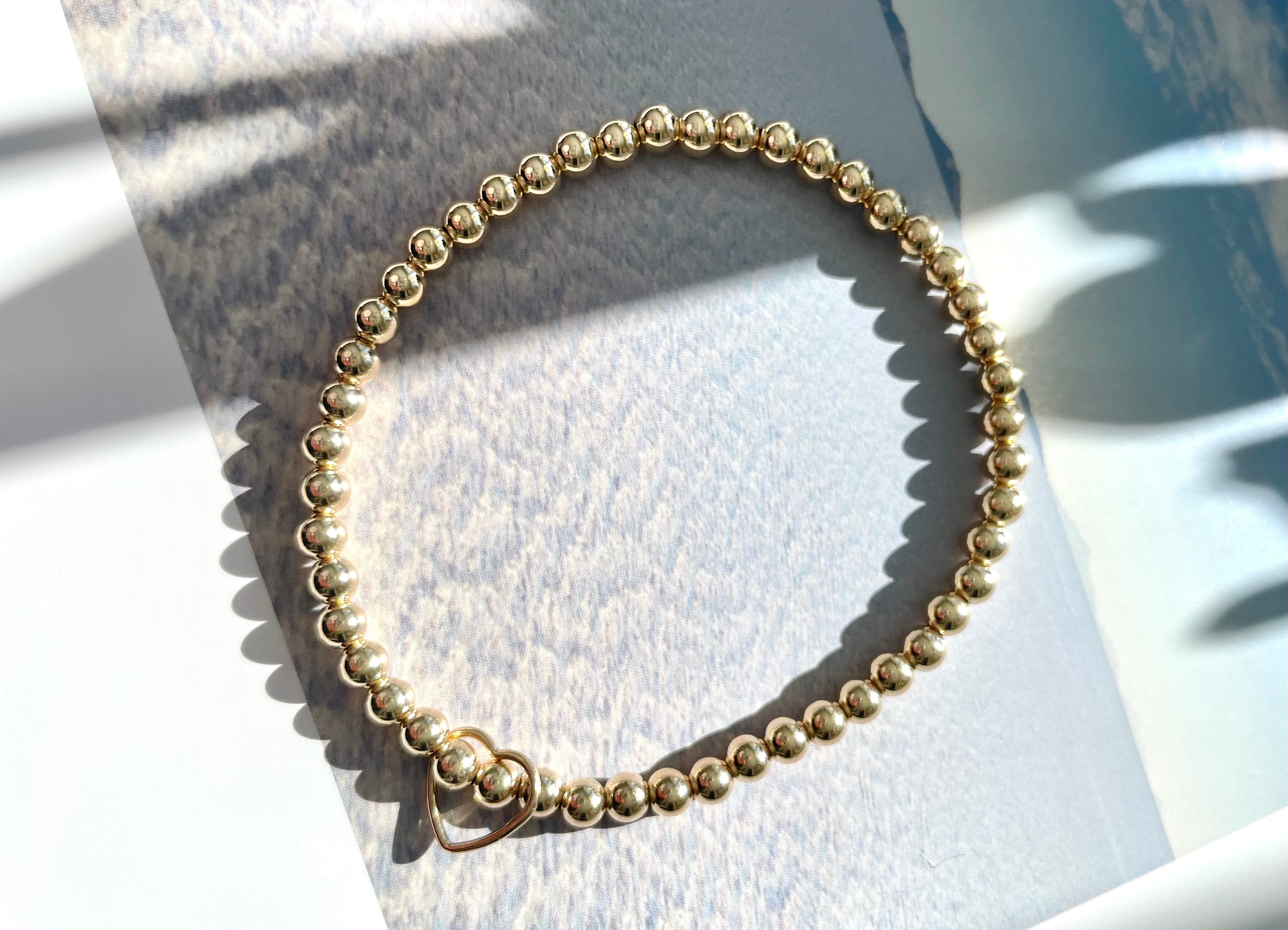 Gold Beaded Bracelet with Floating Heart