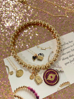 Load image into Gallery viewer, Pink Evil Eye Bracelet with Gold Beads
