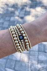 Load image into Gallery viewer, 14k Gold Filled Beaded Gold Bracelet with Black Evil Eye Bead

